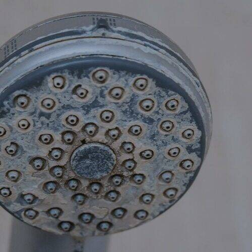 shower covered in limescale