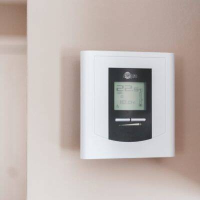 mage of a heating control or thermostat tying in to message on energy saving