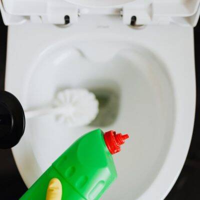 toilet bowl being cleaned